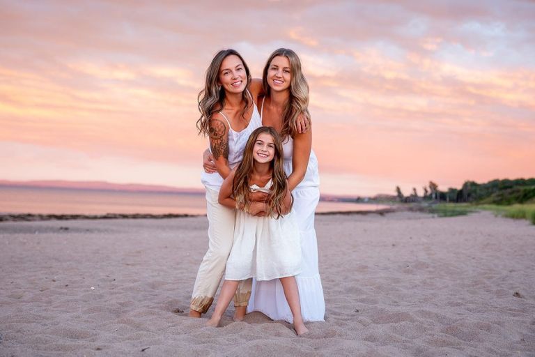 Beach Family Photo taken by Johanna Matthews of Portraits by Johanna. Two women and daughter.